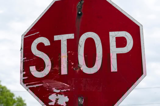 old rusted red stop sign photo