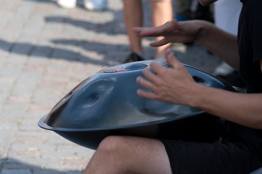 hang drums street artist playing musician detail of hands close up photo