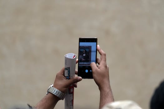 PARIS, FRANCE -OCTOBER 7, 2018 - Mona Lisa painting Louvre hall crowded of tourist photo