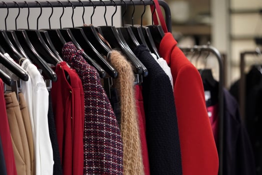 Vintage clothes for sale inside a shop photo