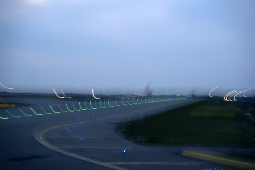 airport lights in motion while taking off at night photo