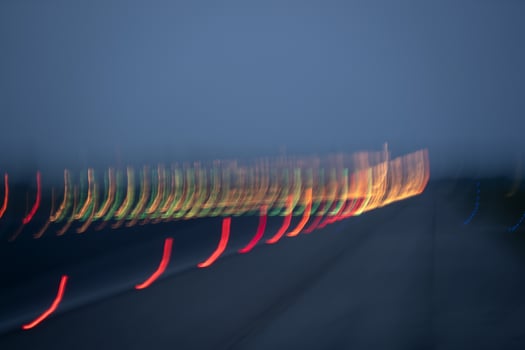 airport lights in motion while taking off at night photo