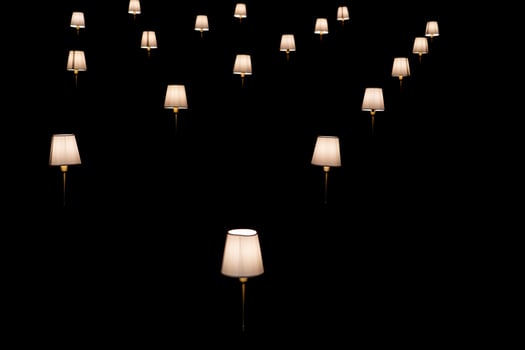 many lamps isolated on black photo