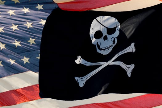 waving pirate flag jolly roger on usa star and stripes photo