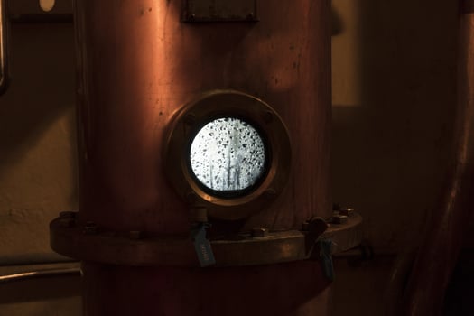 Copper still alembic inside distillery photo
