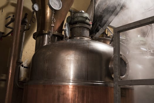 Copper still alembic inside distillery photo
