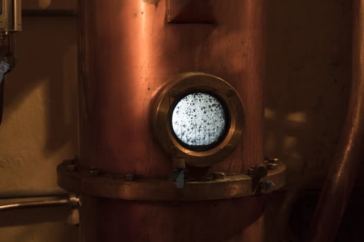 Copper still alembic inside distillery photo