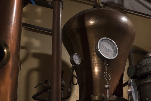 Copper still alembic inside distillery photo