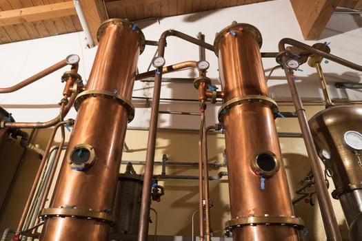 Copper still alembic inside distillery photo