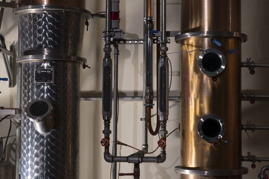 Copper still alembic inside distillery photo