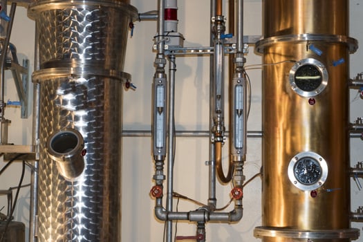 Copper still alembic inside distillery photo