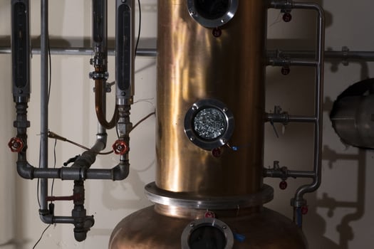 Copper still alembic inside distillery photo