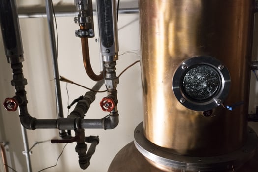 Copper still alembic inside distillery photo
