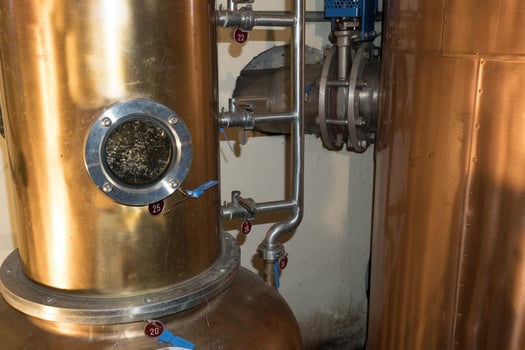 Copper still alembic inside distillery photo