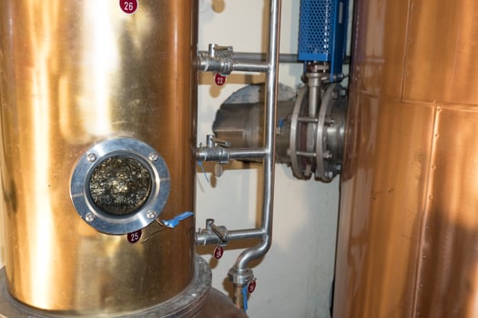 Copper still alembic inside distillery photo