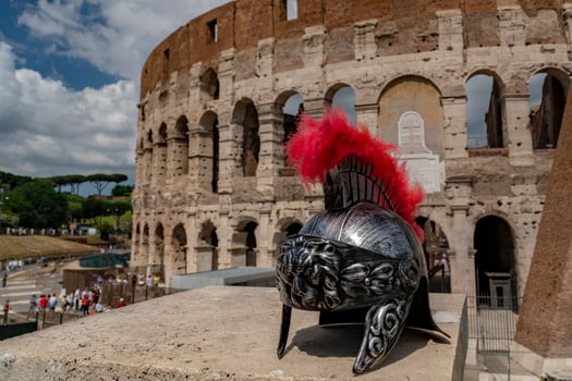 metallic gladiator helm on rome coliseum background photo