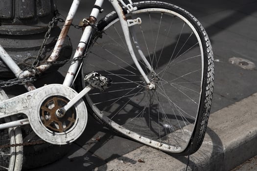 Broken wheel abandoned bicycle photo