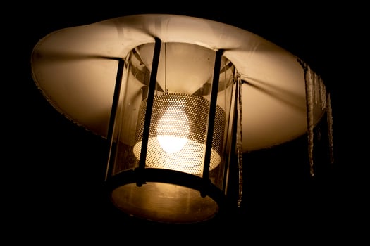 lantern with icicles light in the snow photo