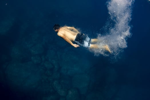 Free diver diving underwater photo