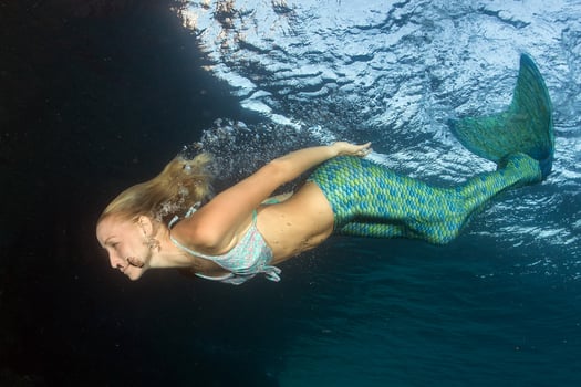 Blonde beautiful Mermaid diver underwater photo