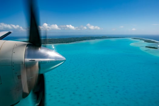 propeller airplane detail flying in tropical paradise photo