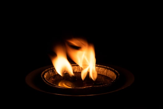 red flame on black background photo