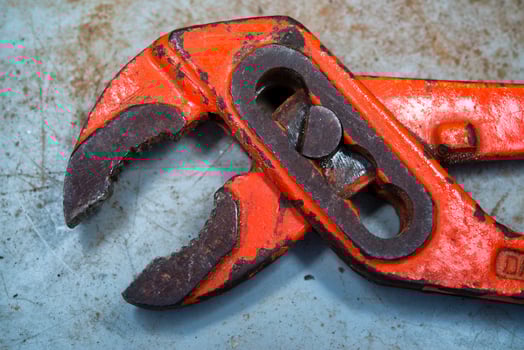 Hard used old red pincers photo