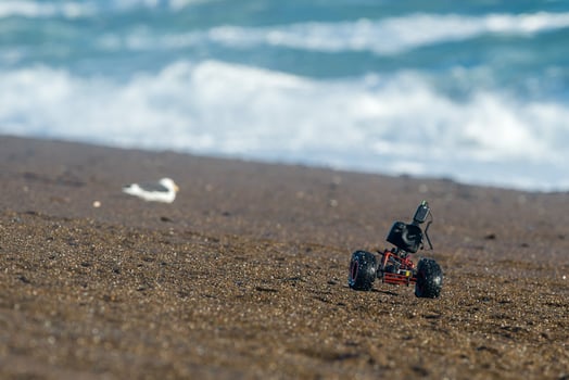 Terrestrial ground drone with camera while driving on the beach photo