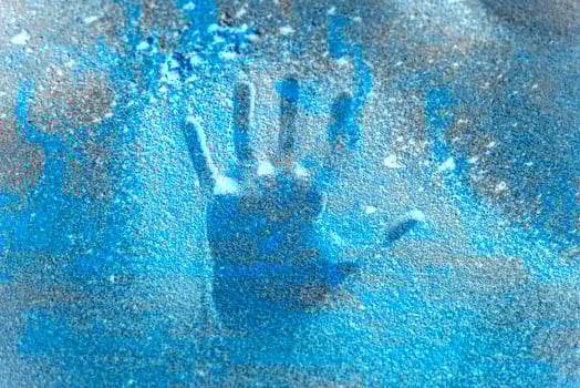 hand handprint on frozen ice photo