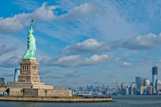 Statue Of Liberty in the deep blue sky photo