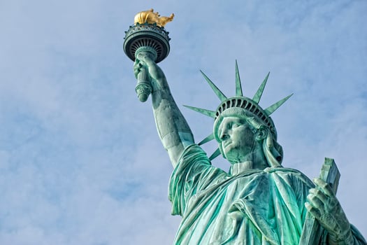 Statue Of Liberty in the deep blue sky photo