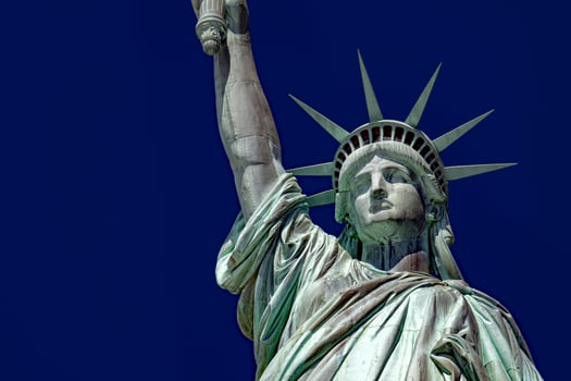 Statue of liberty in New York isolated on blue photo