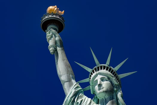 Statue of liberty in New York on blue sky photo