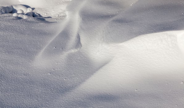 Snow drifts in winter photo