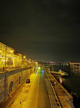 Evening view of The Corvinus University of Budapest with the Danube and the quay photo