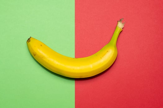 Banana on coloured background still life photo