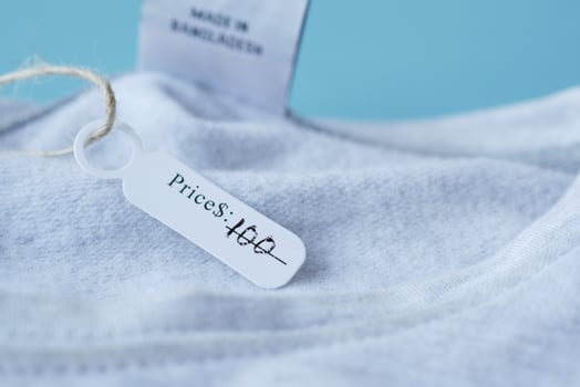 100 dollar price tag on a shirt , photo