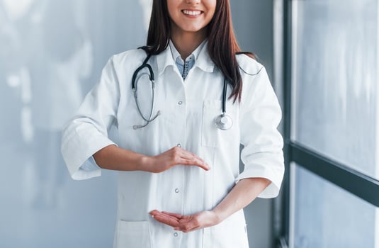 Close up view of young nurse that indoors in modern clinic. Conception of healthcare photo