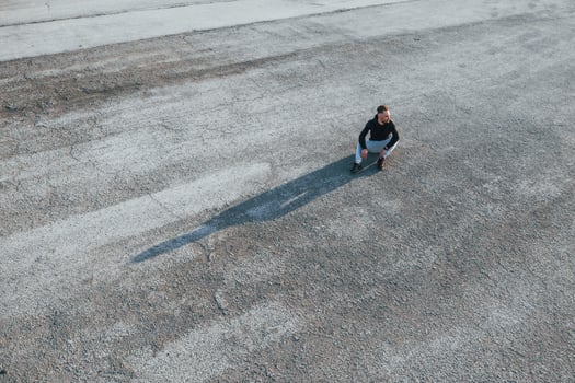 Top view of man that sitting on the road at evening alone photo