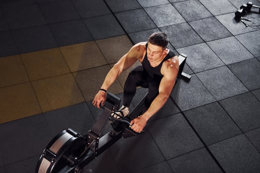 Strong man in sportive clothes have workout day in the gym photo