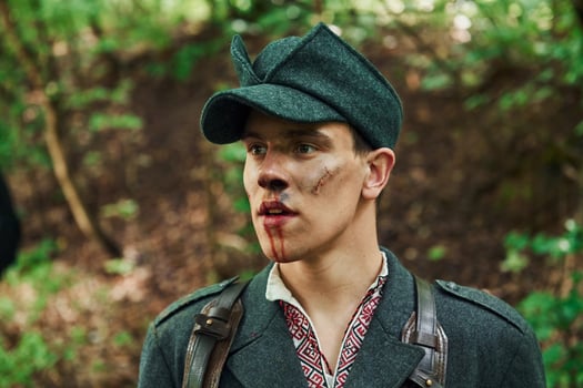 TERNOPIL, UKRAINE - June 2020 UPA Ukrainian Insurgent Army movie filming. Pictures of backstage. Young man with blood on face photo