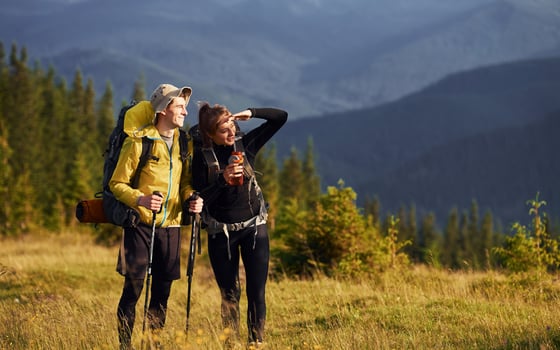 Cute young couple. Majestic Carpathian Mountains. Beautiful landscape of untouched nature photo