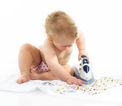 Little girl ironing photo
