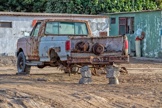 old rusted abandoned car no tires photo
