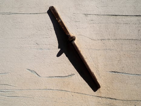 Old iron chain holder on medieval italian house photo