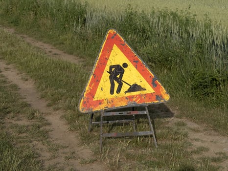 road working sign on country road photo