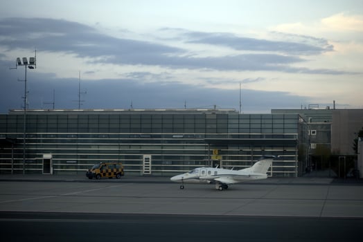 Small tourism plane in airport at sunset photo