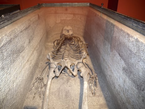 skeleton in roman marble sarchophagus photo