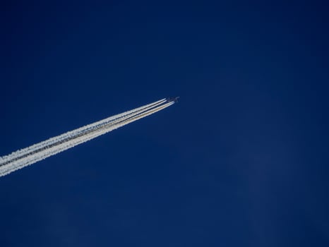 jet airplaine wakes on blue sky photo