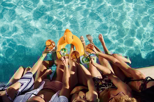 Top view of group of young happy people that have fun in swimming pool at daytime photo